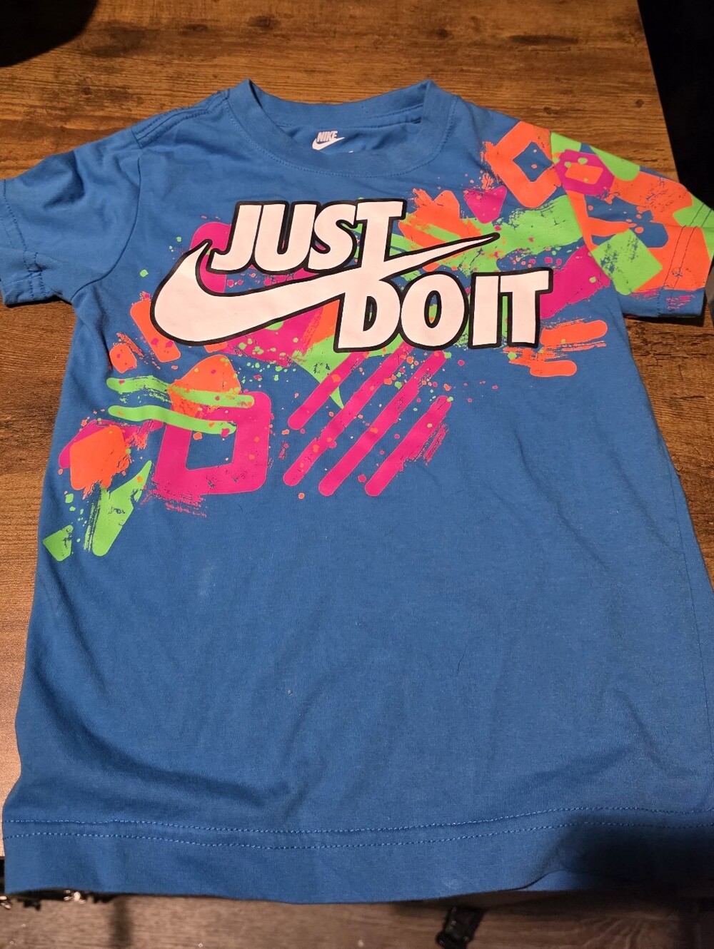 Nike Kids Blue Tee with Neon Pink, Green & Orange Graphic